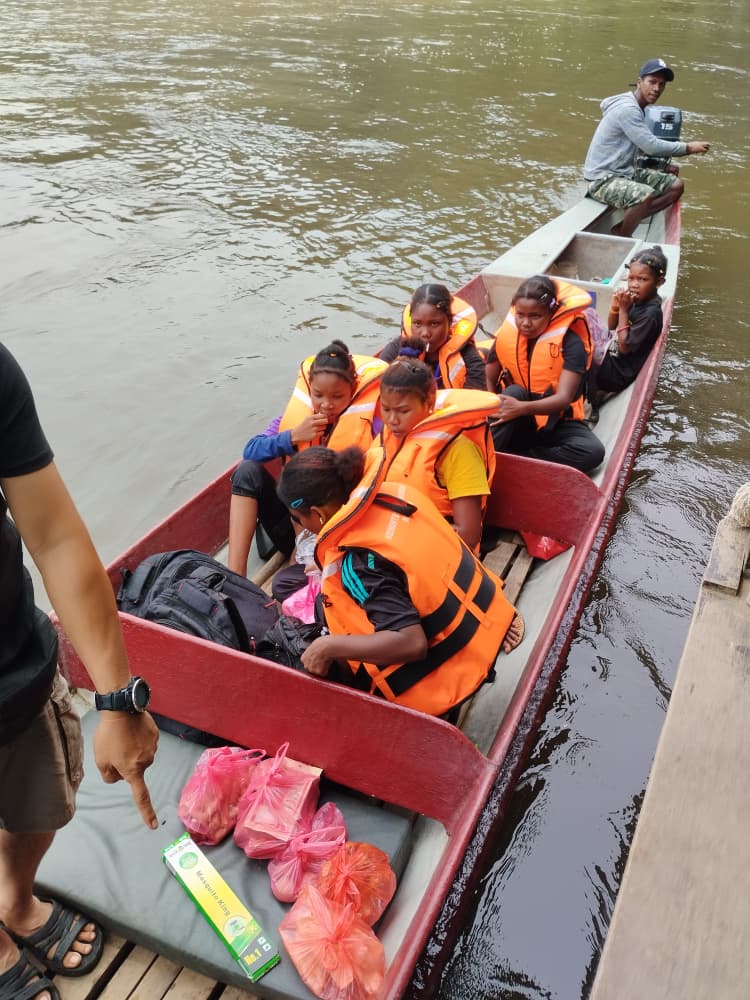 Orang Asli students on school transport boat